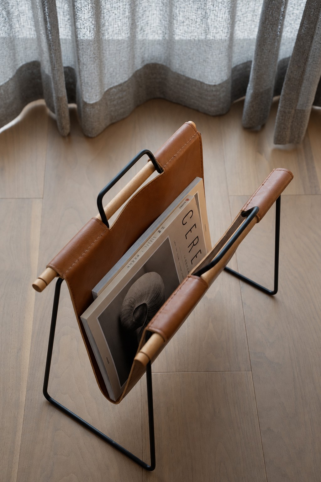 Styling detail / Textiles and a magazine rack · Completed-project photograph
