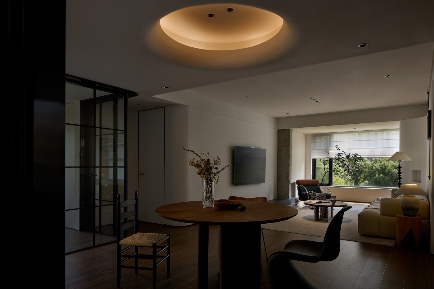 Living and dining area / Timber and pale textiles connect the space · Completed-project photograph